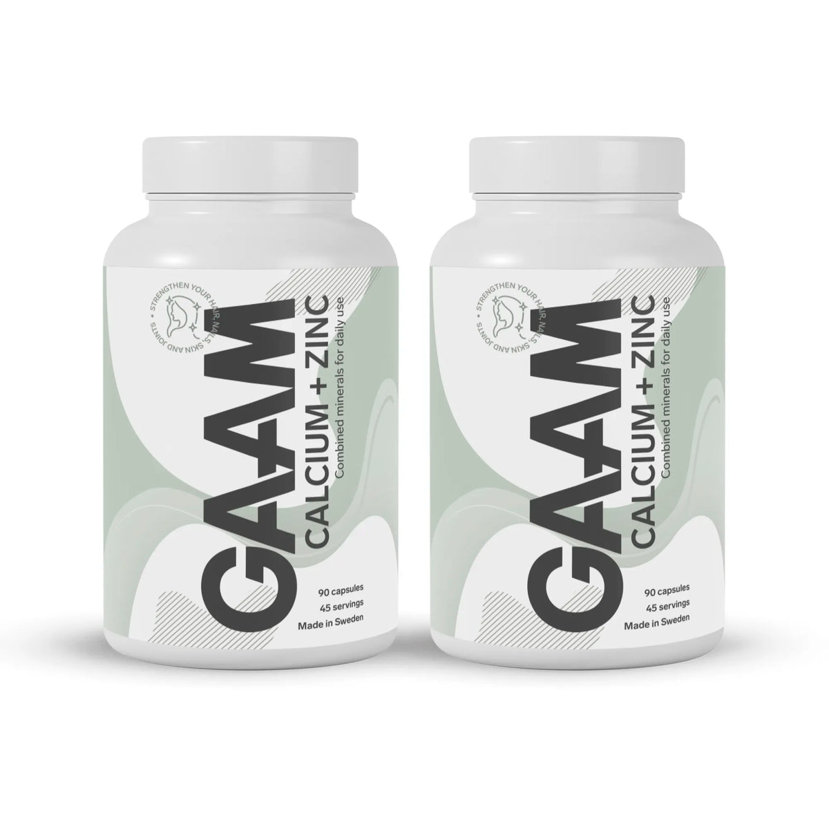 2 x GAAM Calcium + Zinc 90 caps -lisä valkoisissa purkeissa, joissa harmaanvihreitä yksityiskohtia ja musta teksti.