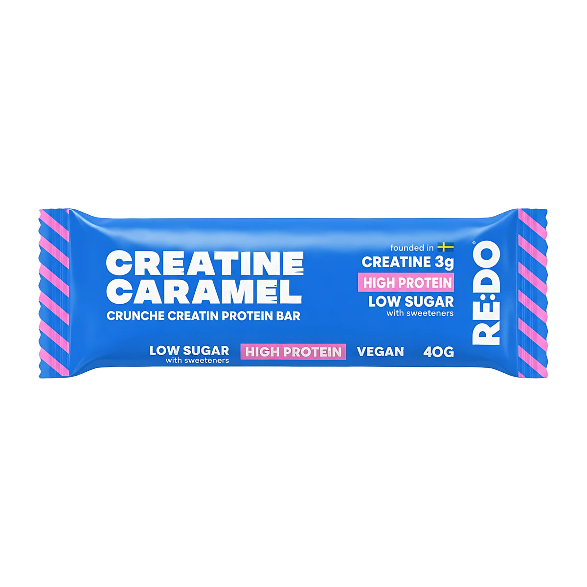 RE:DO Creatine Bar 40 g -vegaaninen proteiinipatukka sinisessä pakkauksessa vaaleanpunaisin ja valkoisin yksityiskohdin., kuva 1/3
