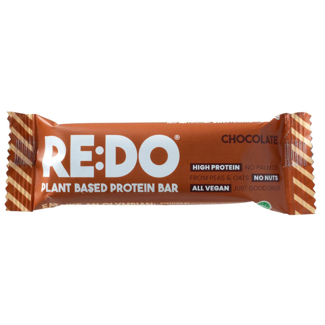 REDO Bar 60 g vegaaninen proteiinipatukka ruskeassa pakkauksessa valkoisilla yksityiskohdilla, makuna Chocolate Chock., kuva 1/4