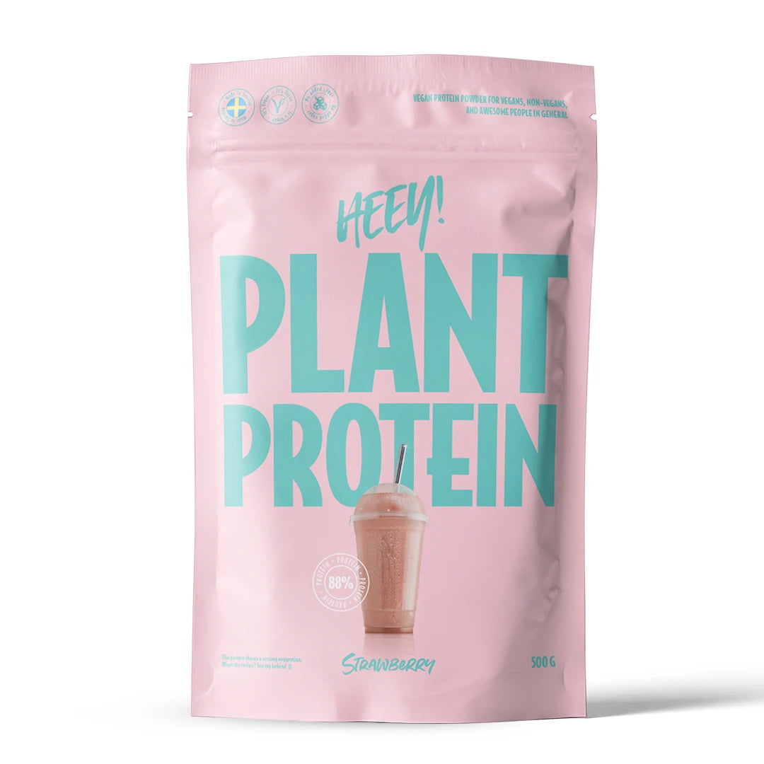 Heey! Vegaaninen proteiini 500 g -proteiinijauhe vaaleanpunaisessa pussissa turkoosilla tekstillä, makuna mansikka., kuva 2/9