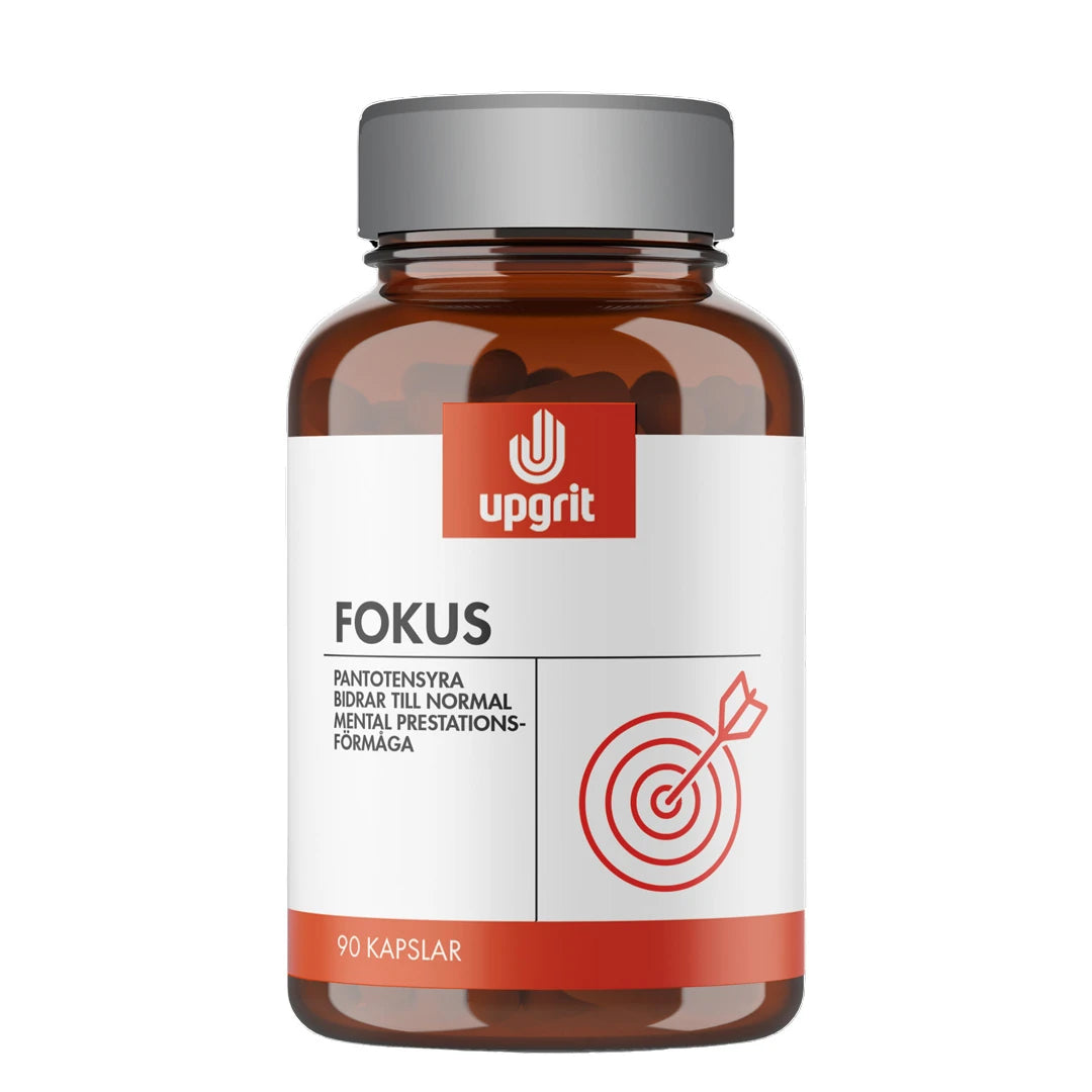 Upgrit Fokus 90 caps -ravintolisä ruskeassa purkissa, jossa on harmaa kansi, valkoinen etiketti ja punainen maalitaulu., kuva 1/1