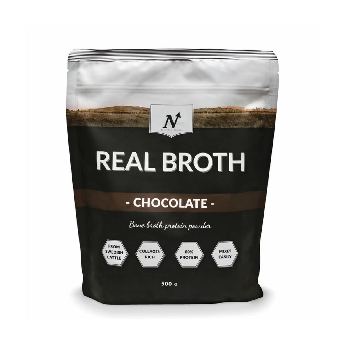 Nyttoteket Real Broth 500 g -luuliemijauhe mustavalkoisessa pussissa ruskeilla yksityiskohdilla, makuna Chocolate., kuva 2/2
