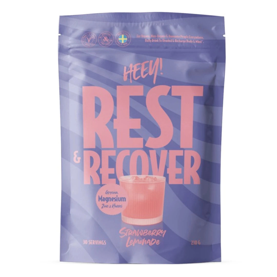 Heey! Rest &amp; Recover Magnesium 210 g -jauhe liilassa pussissa pinkeillä yksityiskohdilla, makuna Strawberry Lemonade., kuva 1/1