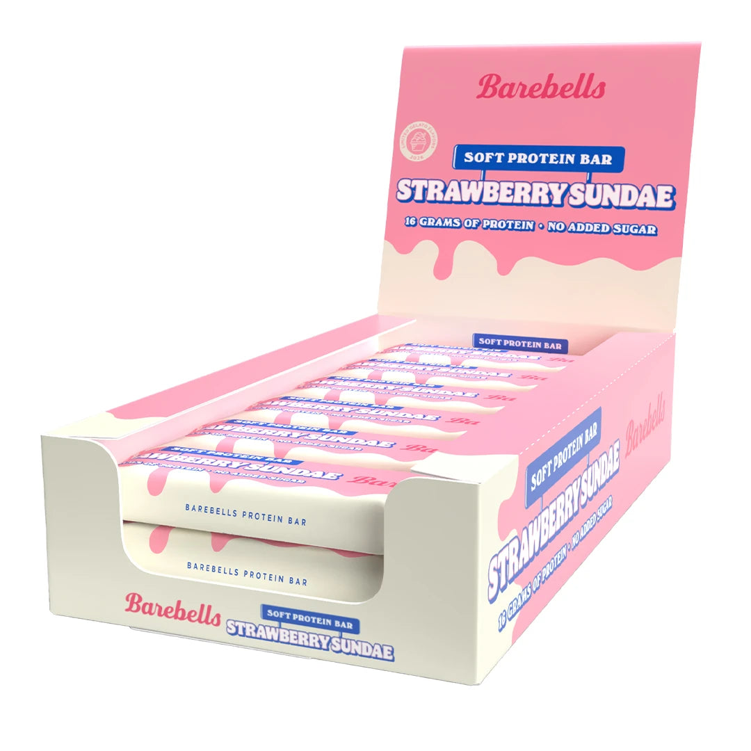 12 x Barebells Soft Bar 55 g Strawberry Sundae vaaleanpunaisessa laatikossa, jossa on pakattuja proteiinipatukoita., kuva 1/1