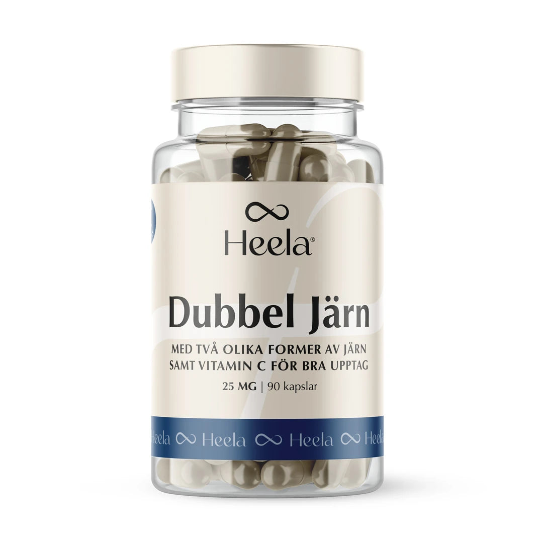 Heela Dubbel Järn 25 mg 90 caps -kapselit läpinäkyvässä muovipurkissa, jossa on beige ja sininen etiketti., kuva 1/1