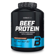 BioTechUSA Beef Protein 1.816 kg -proteiinijauhe mustassa purkissa sinisillä yksityiskohdilla, makuna Chocolate Coconut.