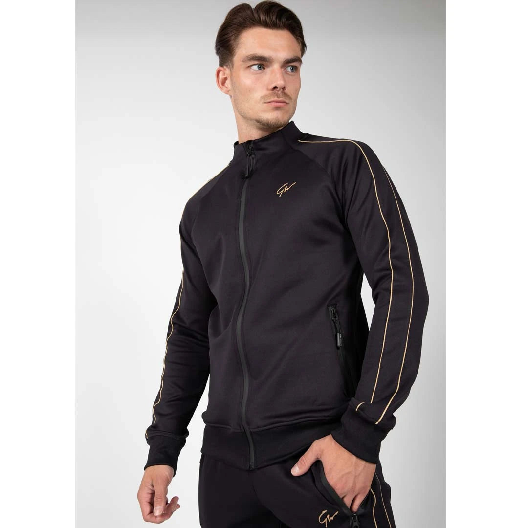 Gorilla Wear Wenden Track Jacket Black/Gold är en svart träningsjacka i stretch med dragkedja och gulddetaljer., bild 1 av 8