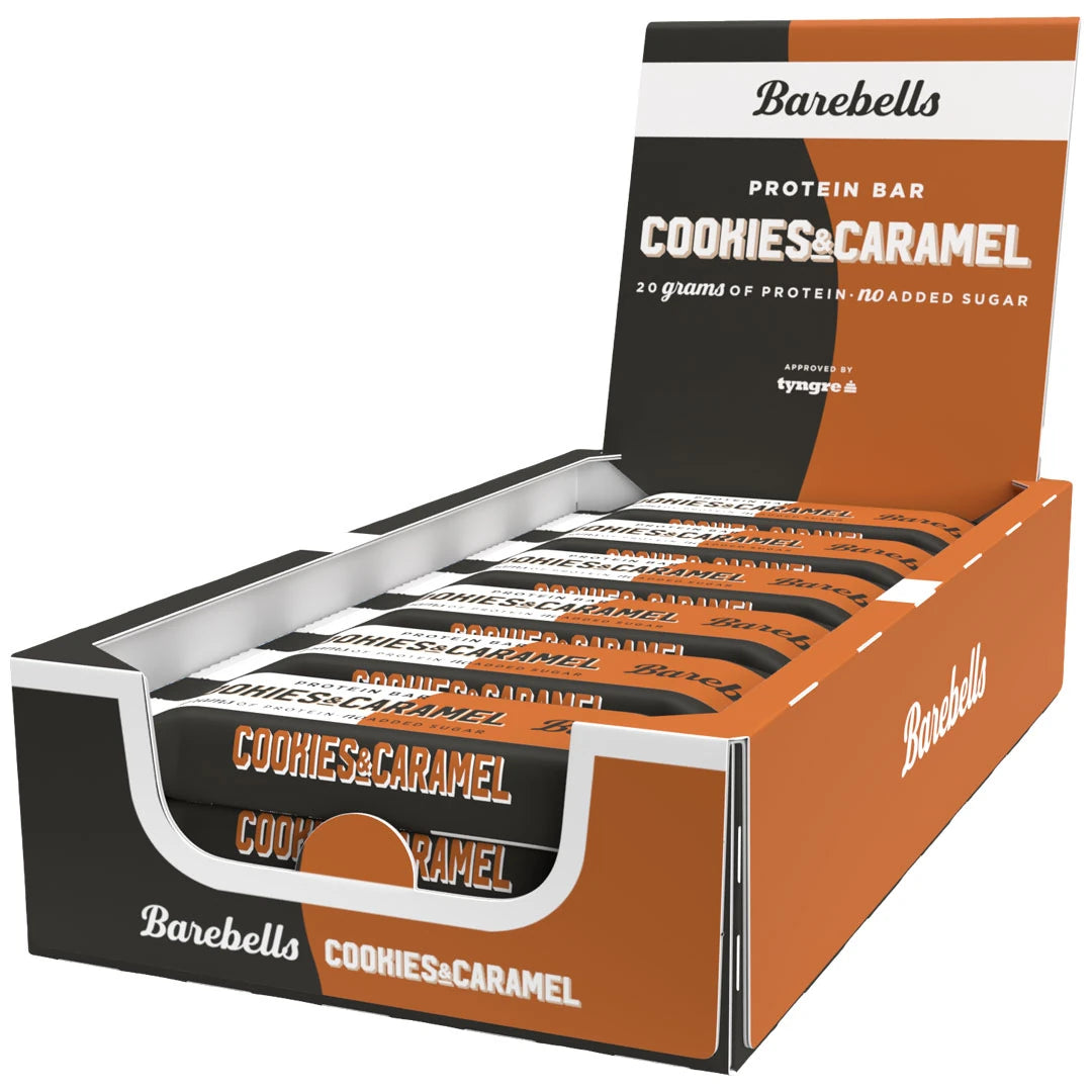 12 x Barebells Protein Bar 55 g Cookies &amp; Caramel ruskea-mustassa esittelylaatikossa täynnä proteiinipatukoita., kuva 1/1