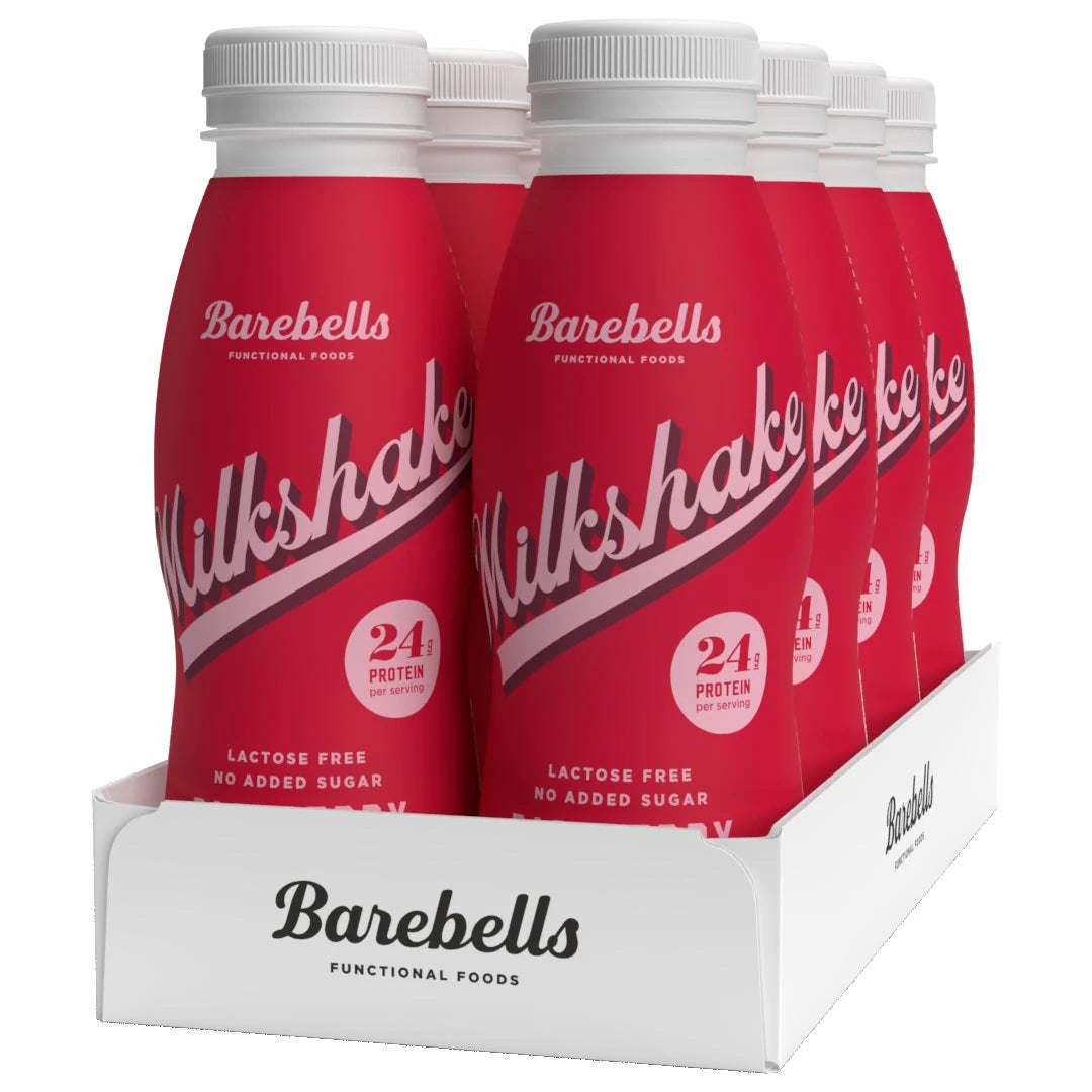 8 x Barebells Milkshake 330 ml Raspberry valkoisessa laatikossa, jossa on kahdeksan punaista vadelmanmakuista pulloa., kuva 1/1