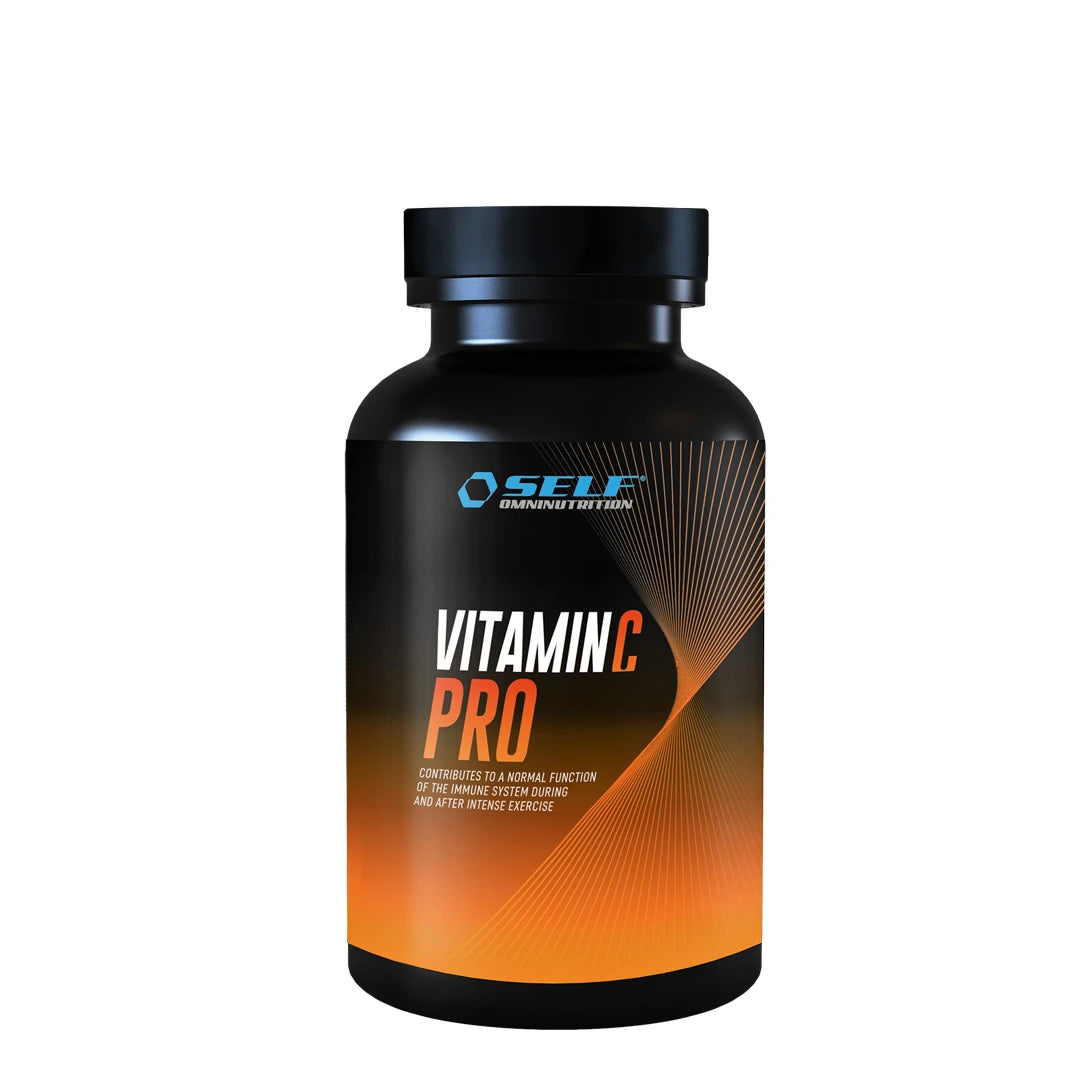 Self Omninutrition Vitamin C PRO 100 Tabs -ravintolisä pakattuna mustaan purkkiin, jossa on oransseja yksityiskohtia., kuva 1/1