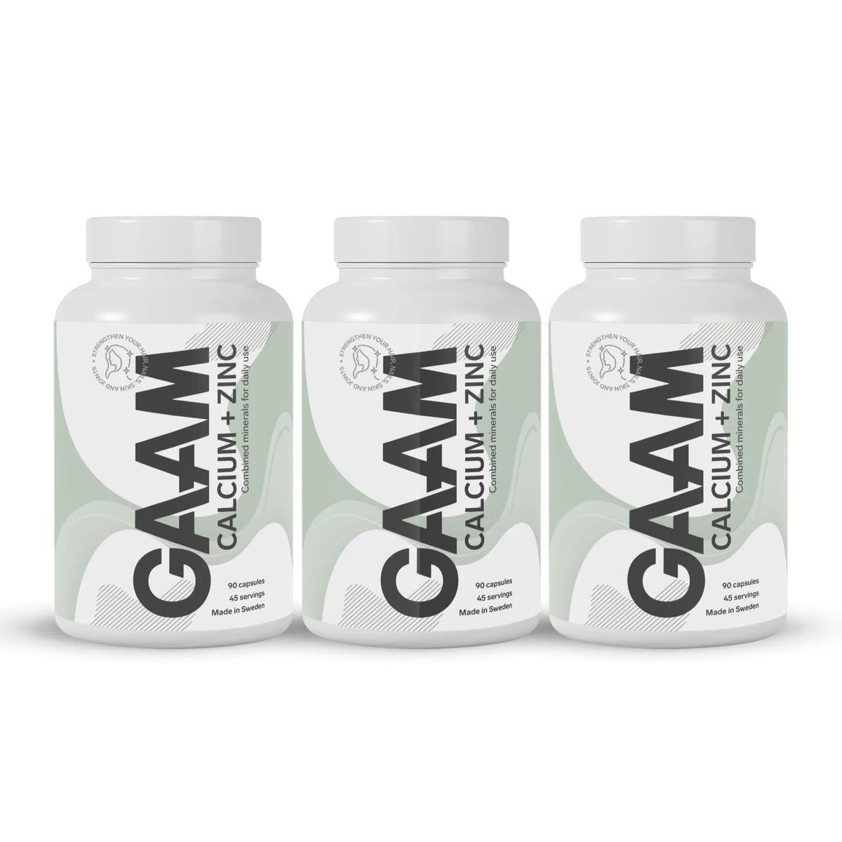 3 x GAAM Calcium + Zinc 90 caps valkoisissa purkeissa, joissa on vihreävalkoiset etiketit ja mustia yksityiskohtia., kuva 1/1